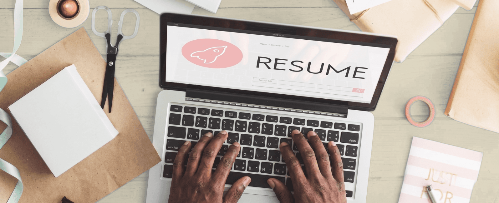 Workspace typing hands with Resume on screen